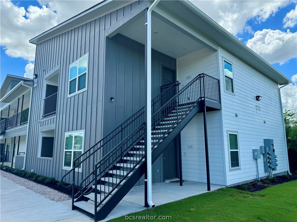 a view of balcony with deck and stairs