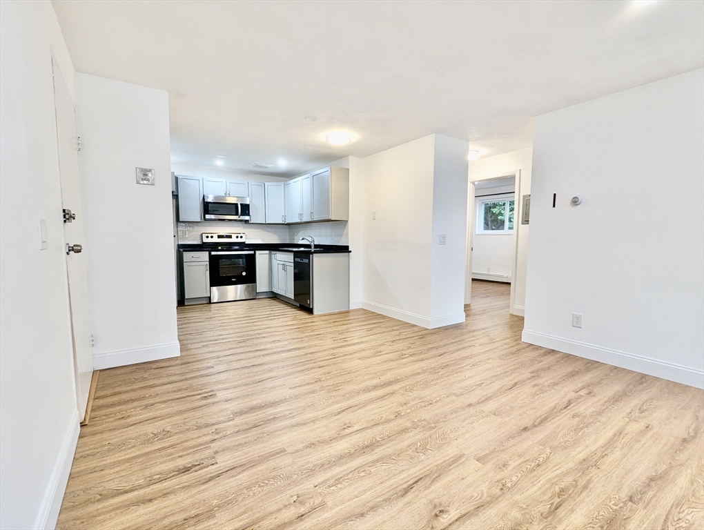 a view of a kitchen from the hallway