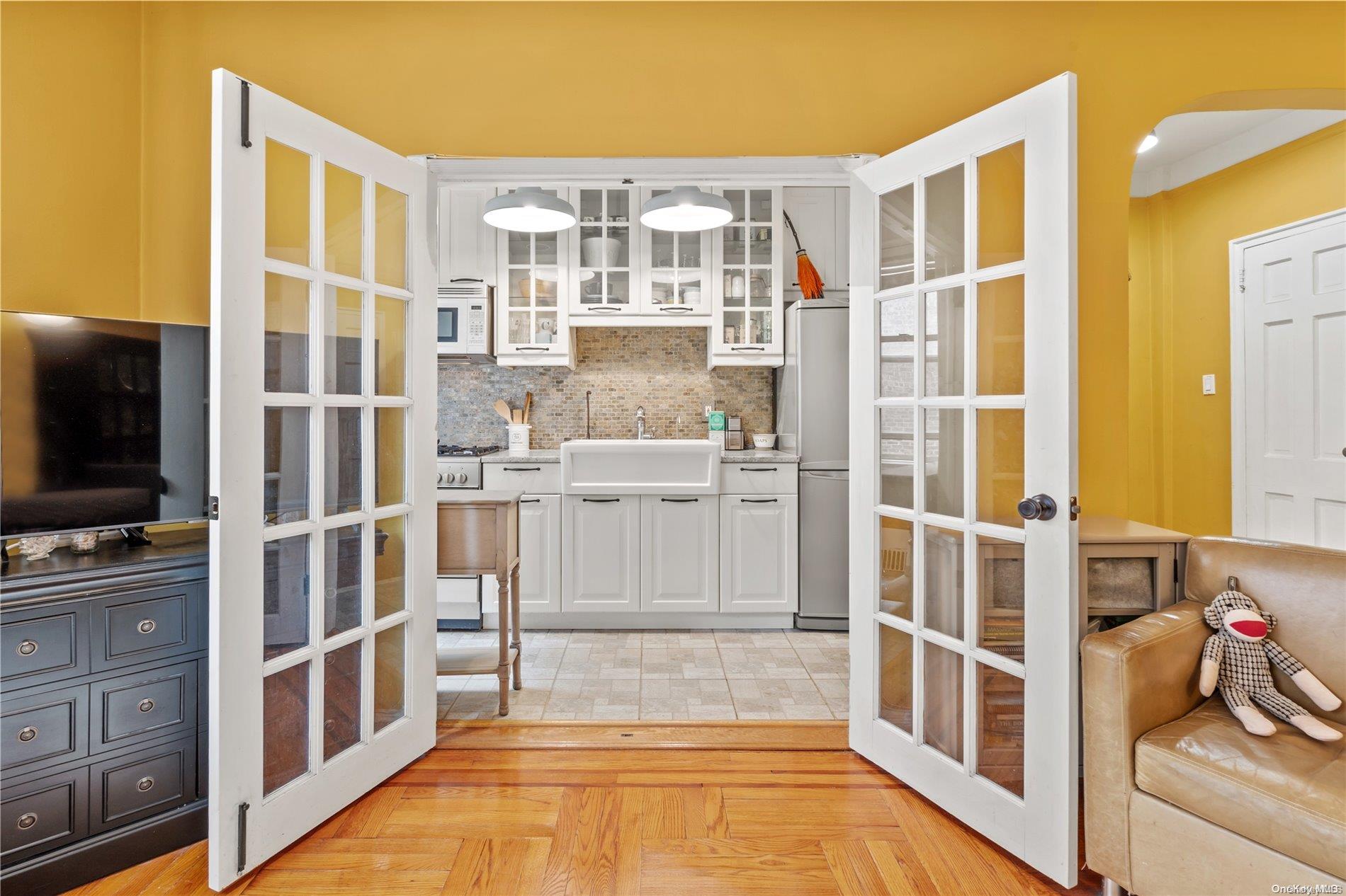 a view of a kitchen with a sink and breakfast area