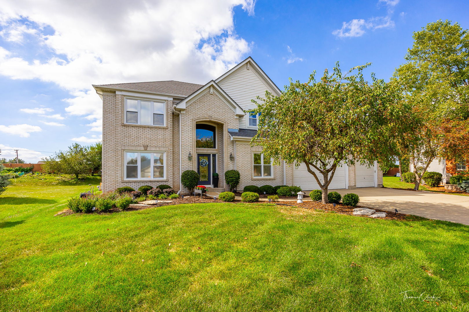 a front view of a house with a yard