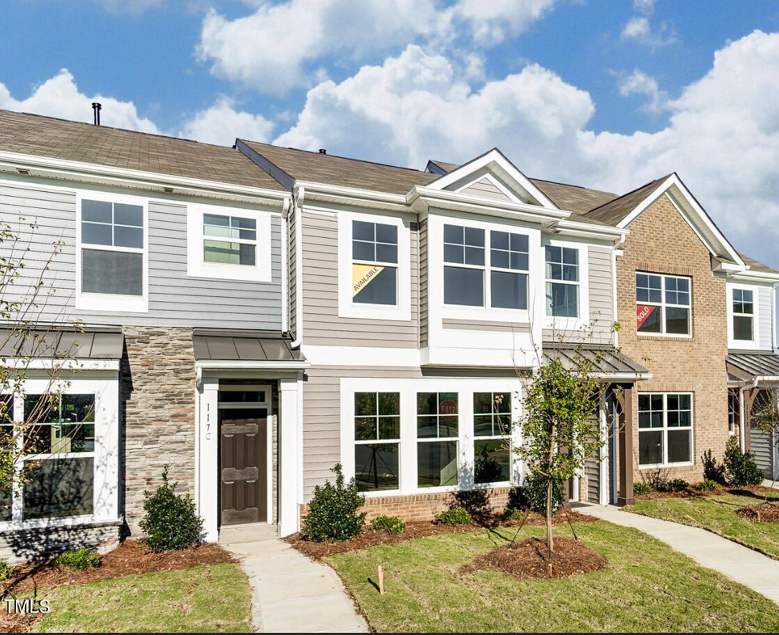 front view of a house with a yard