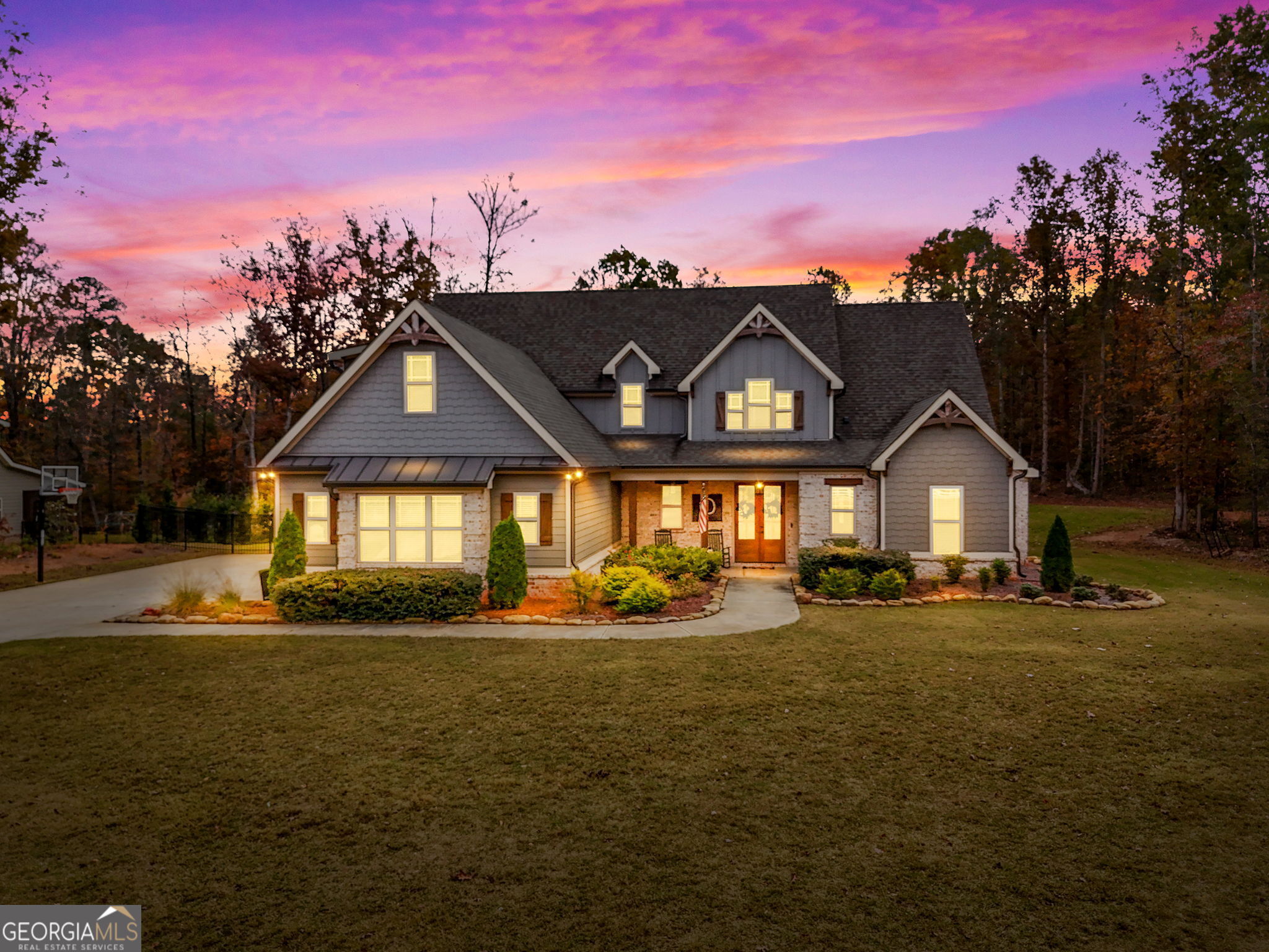 a front view of a house with a yard