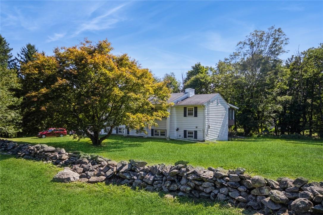 a view of a house with a big yard