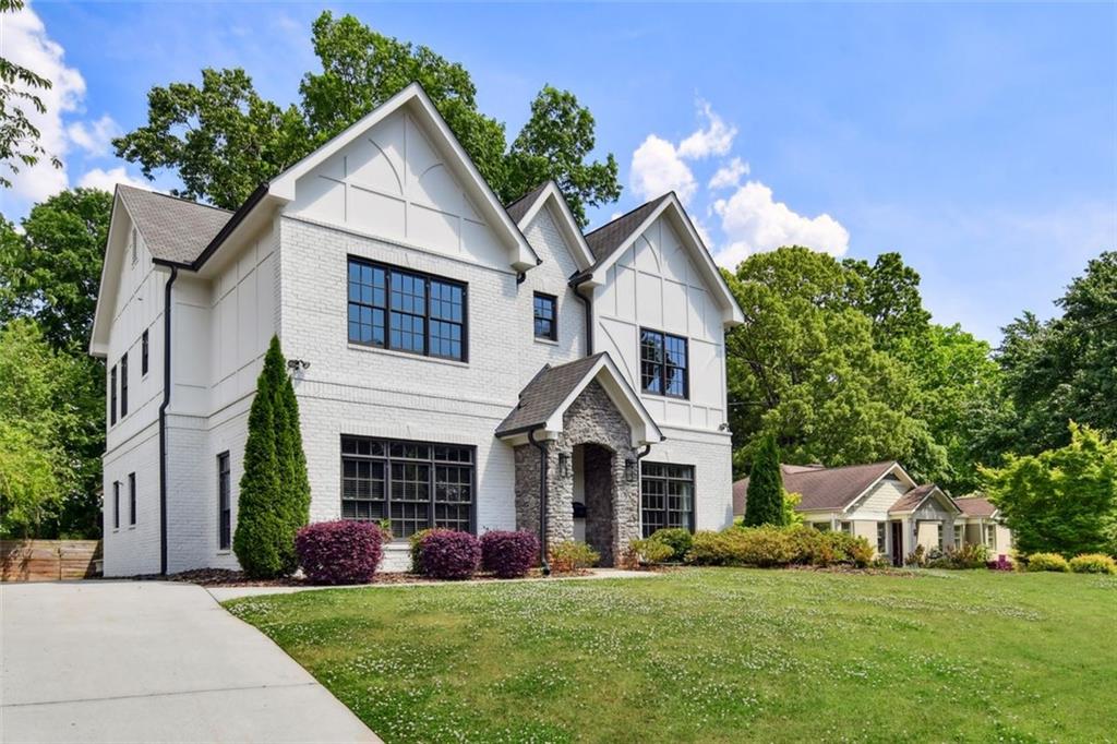 a front view of a house with a yard