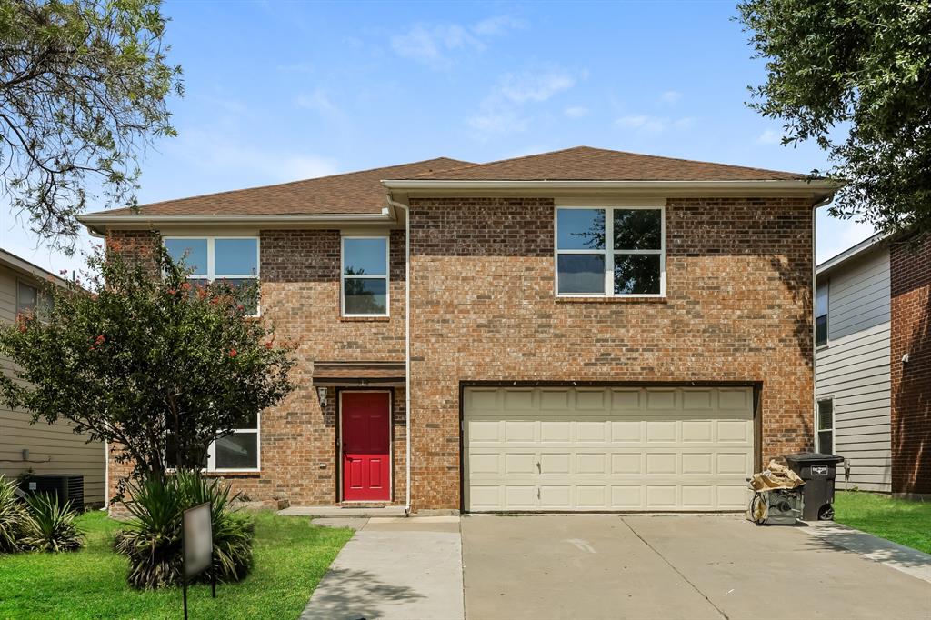 a front view of a house with yard