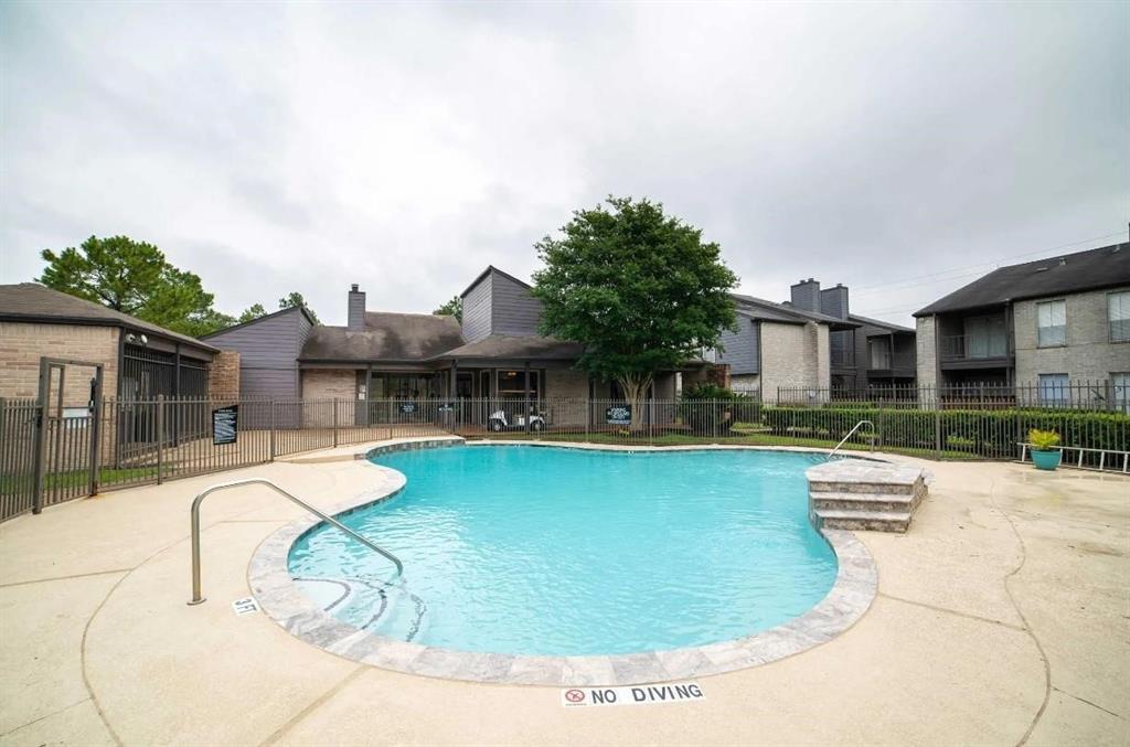 a swimming pool with outdoor seating yard and barbeque oven