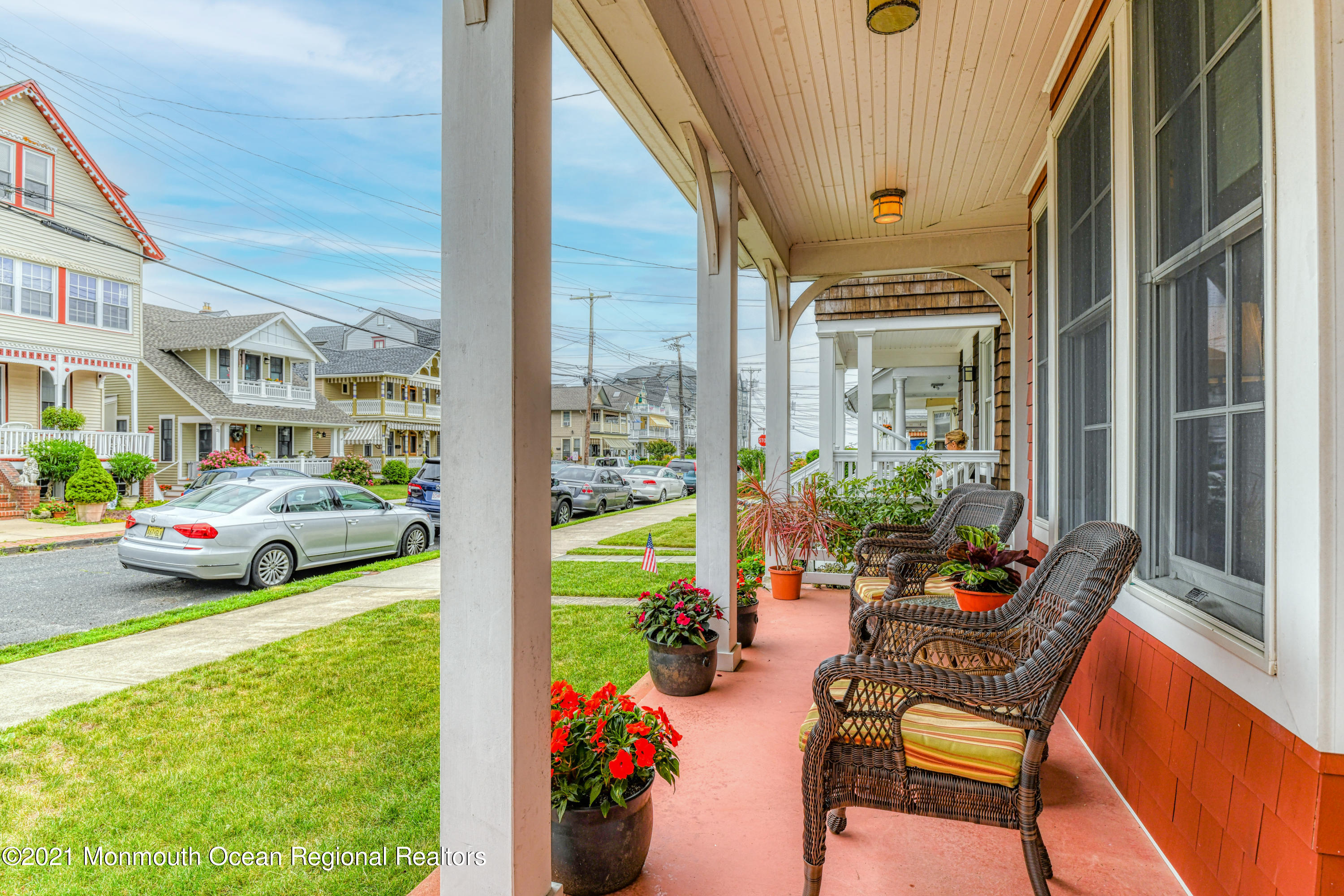 a view of yard from deck with patio