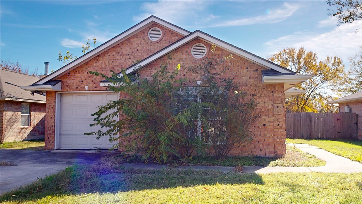 View of front of property with a front yard and a