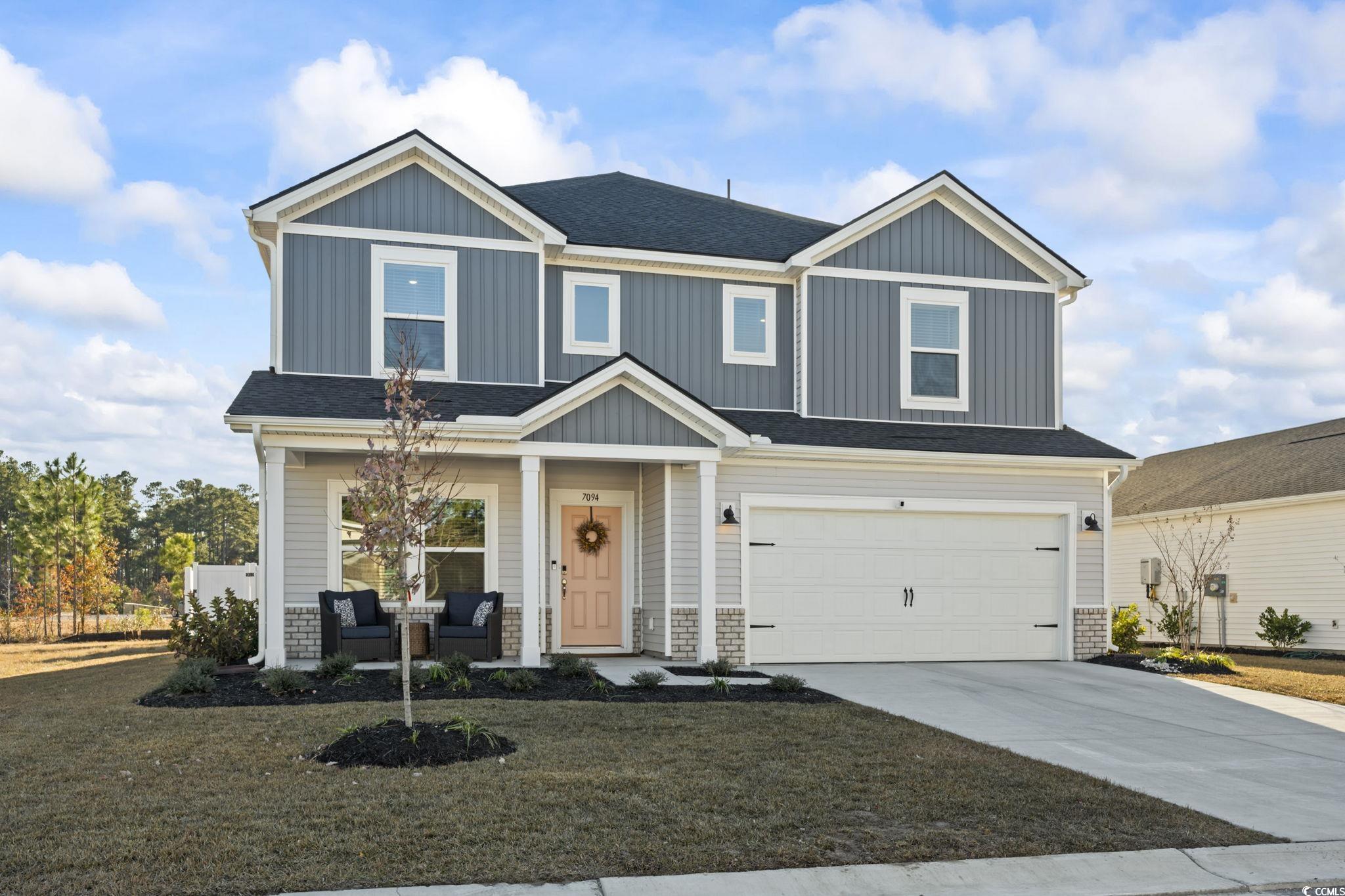 Craftsman inspired home with a garage and a front