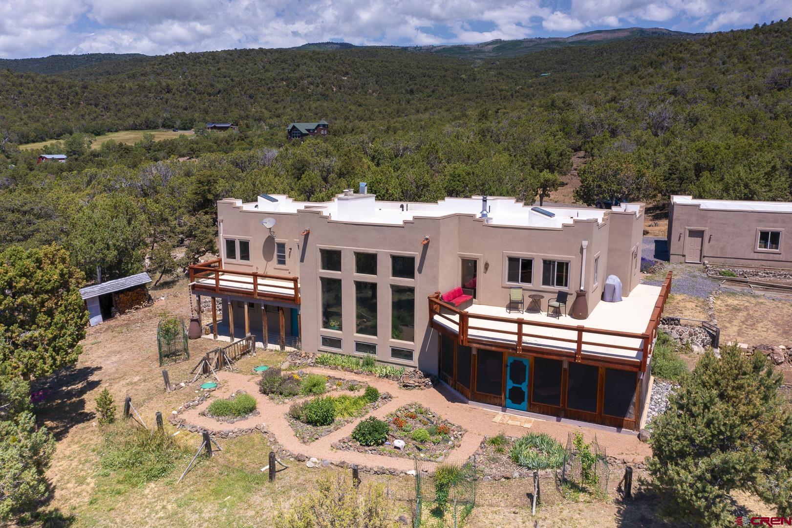 an aerial view of residential houses with outdoor space