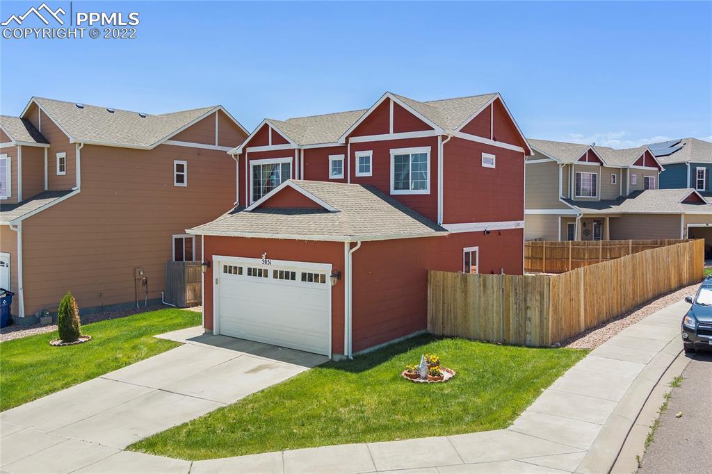 a front view of a house with a yard