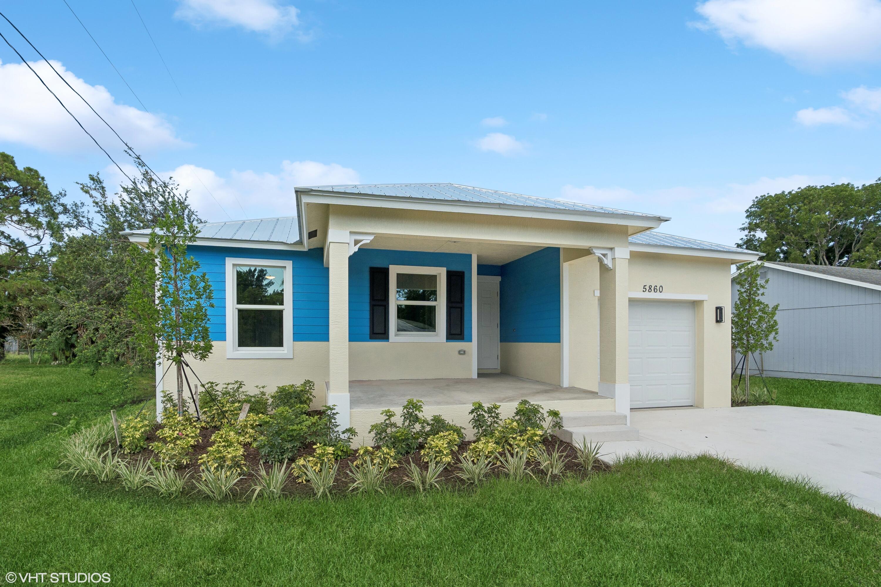 front view of a house with a yard