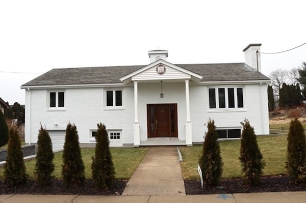 a front view of a house with glass windows