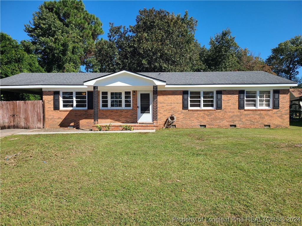 front view of a house with a yard