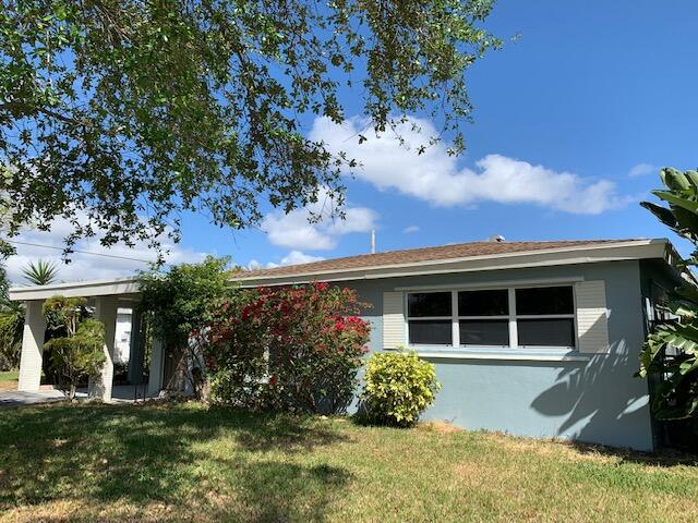 front view of a house with a yard