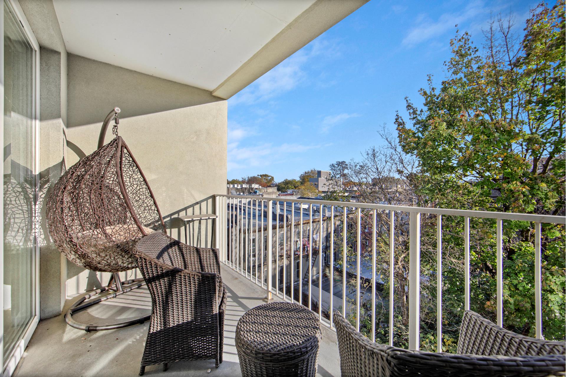 a view of a balcony with furniture