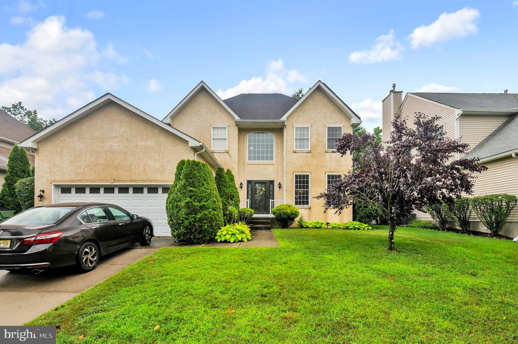 a view of a house with a cars park