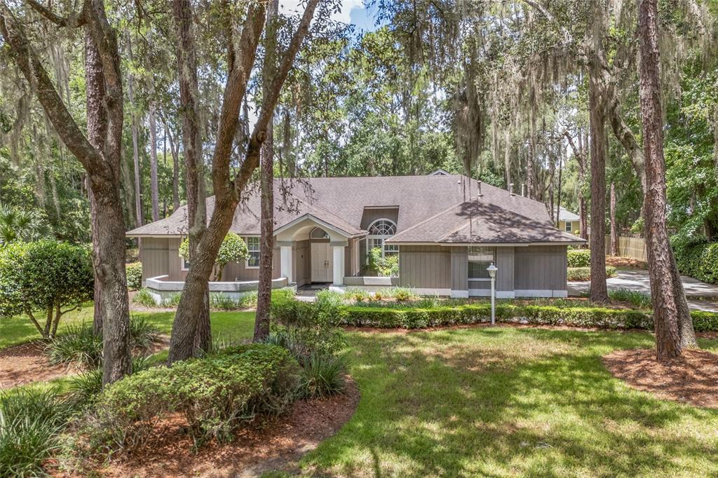 a house with trees in the background