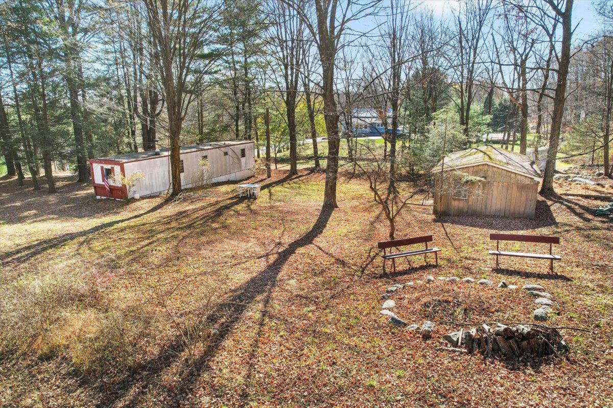 View of yard with a shed