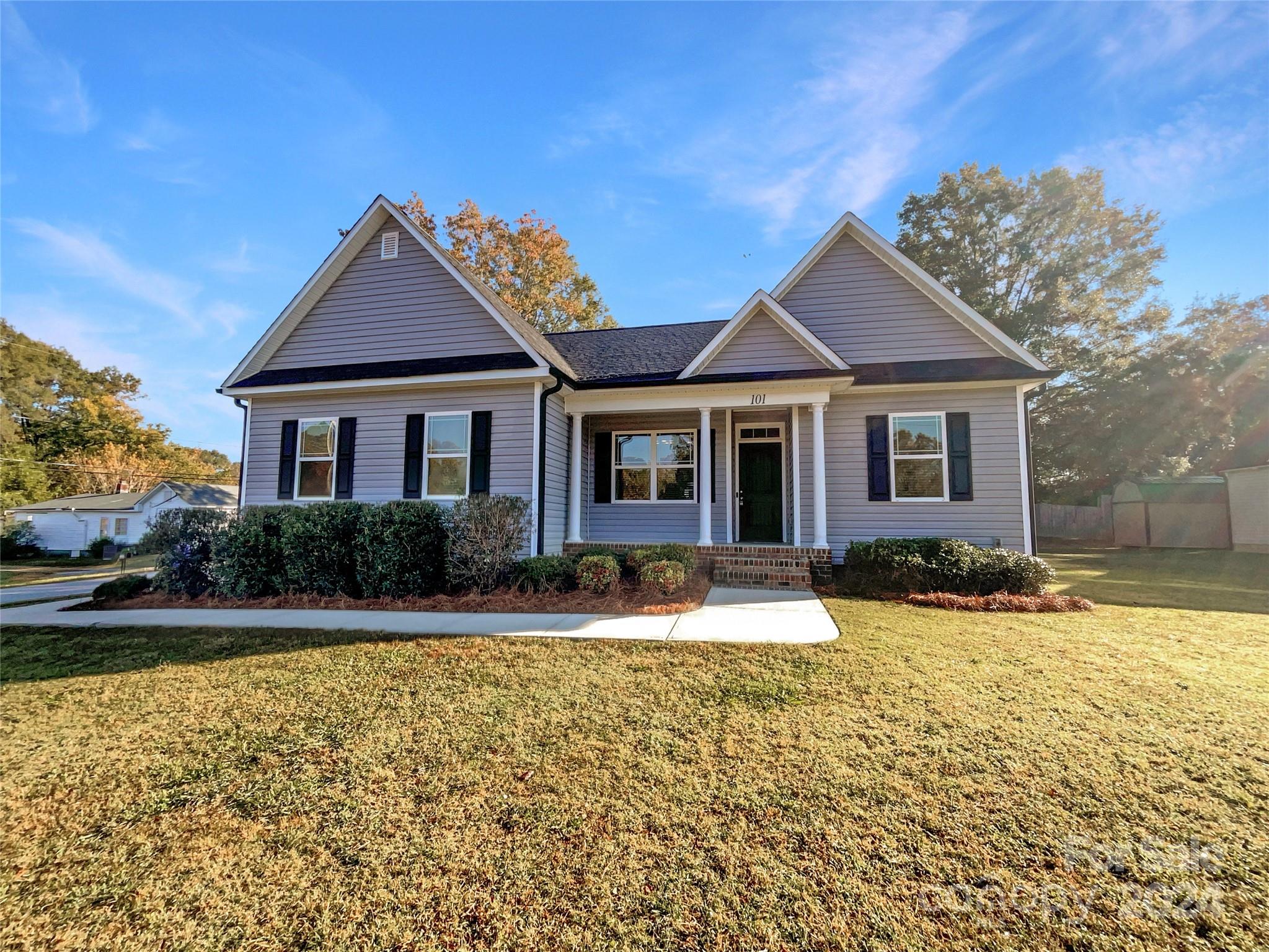 a front view of a house with a yard