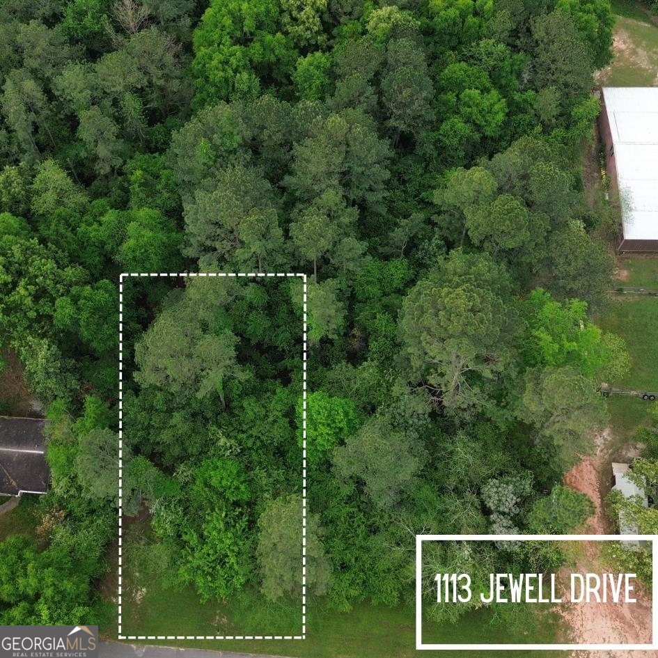 an aerial view of a park with welcome board