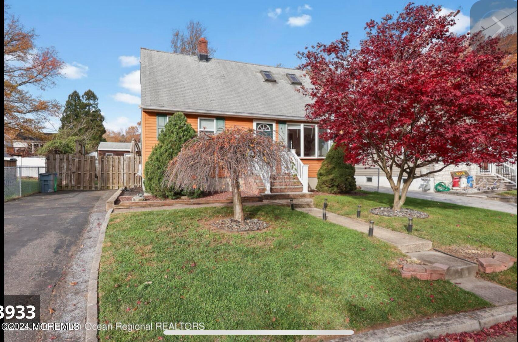 a view of a house with a yard