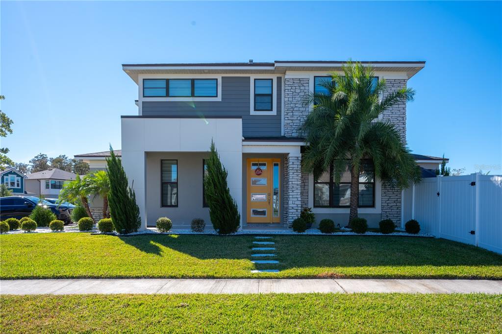 a front view of a house with a yard