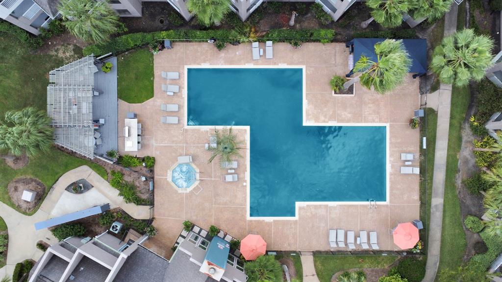 an aerial view of residential houses with outdoor space and street view