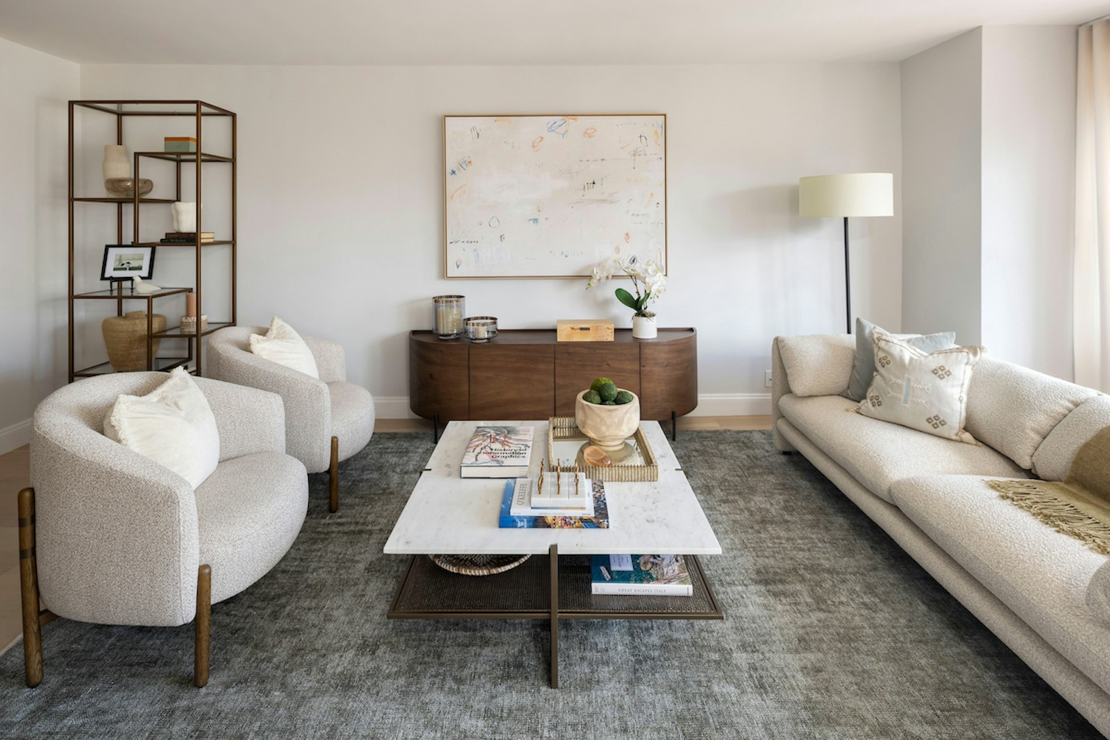 a living room with furniture and a table