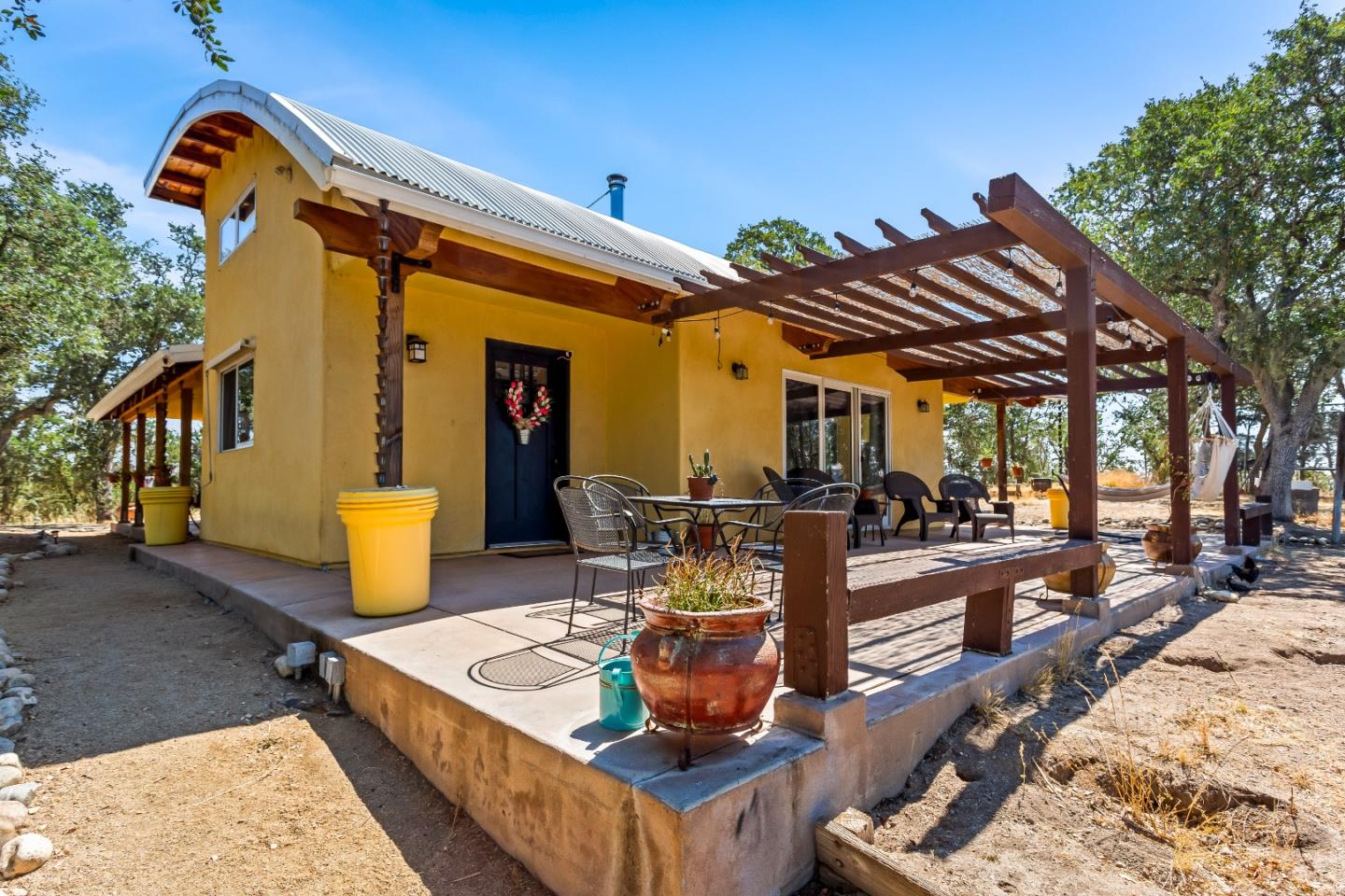 a view of a backyard with sitting area