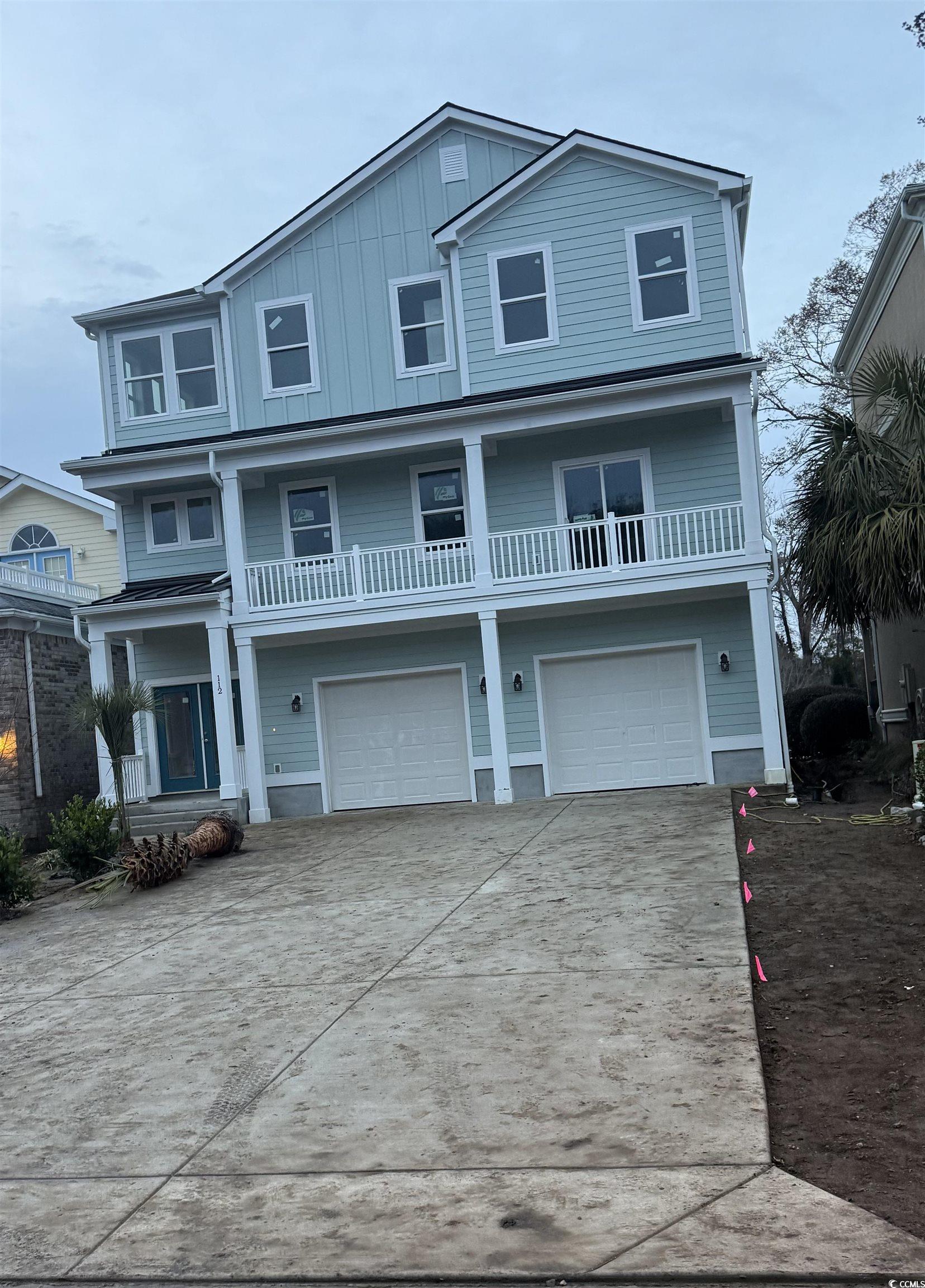 Beach home featuring a garage