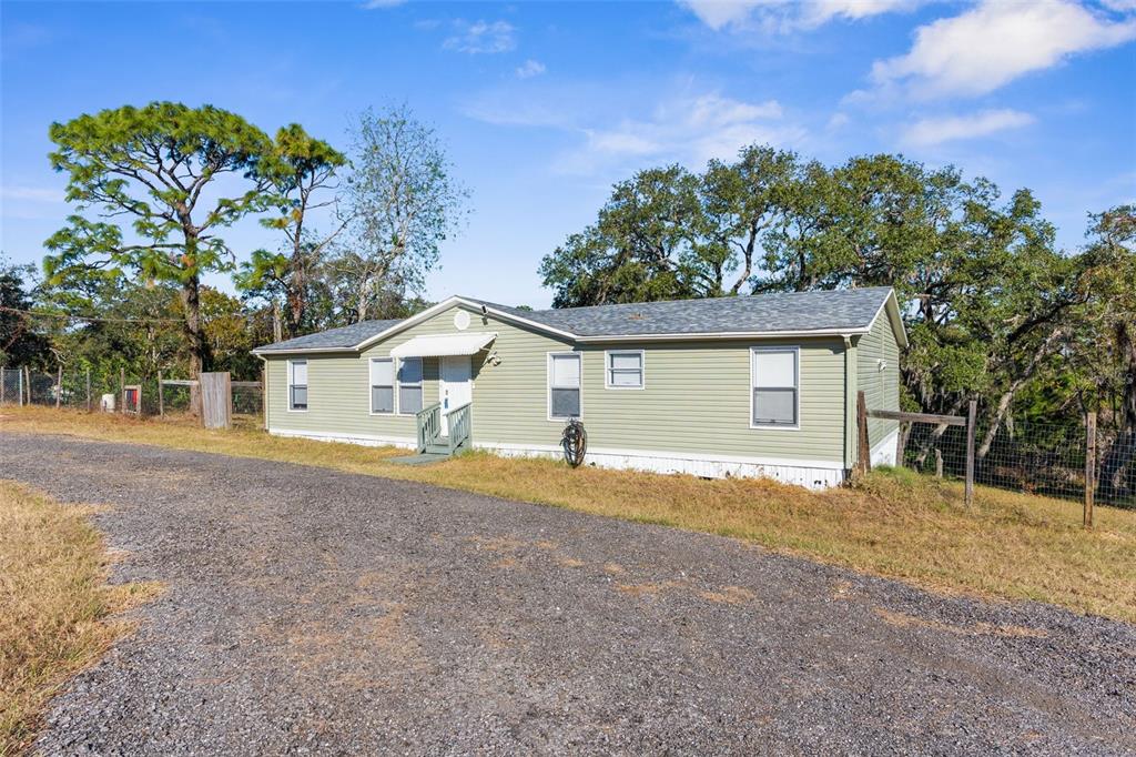 a house with trees in the background