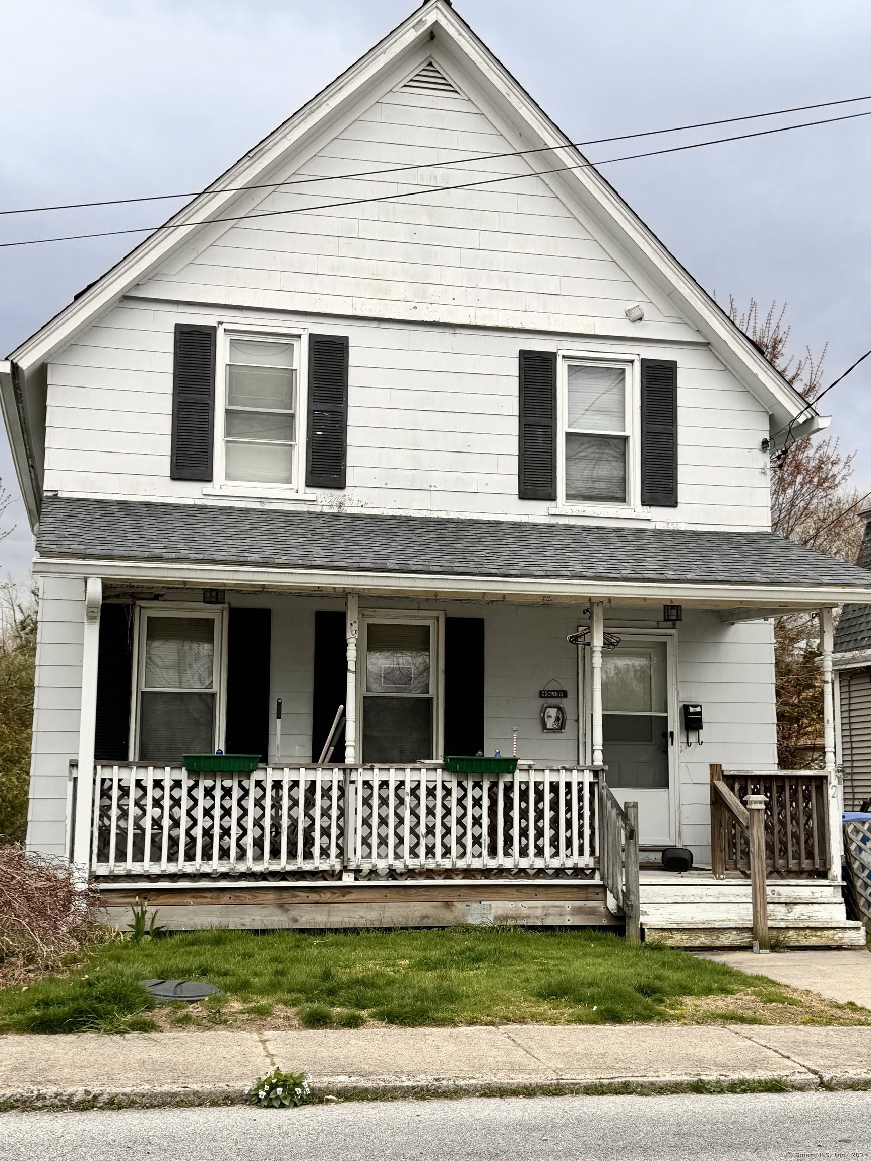 a view of a brick house with a yard