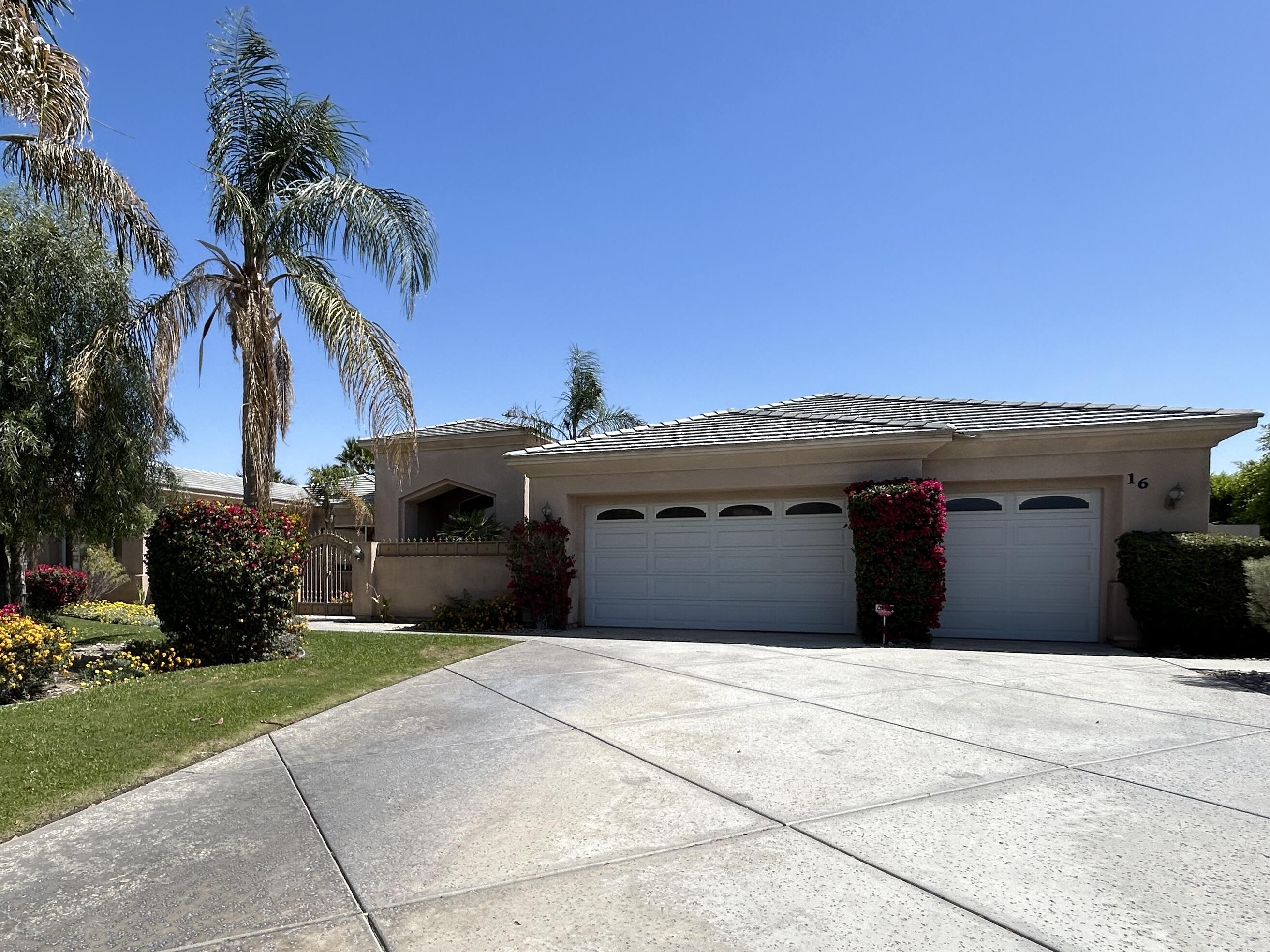 a front view of a house with a garage