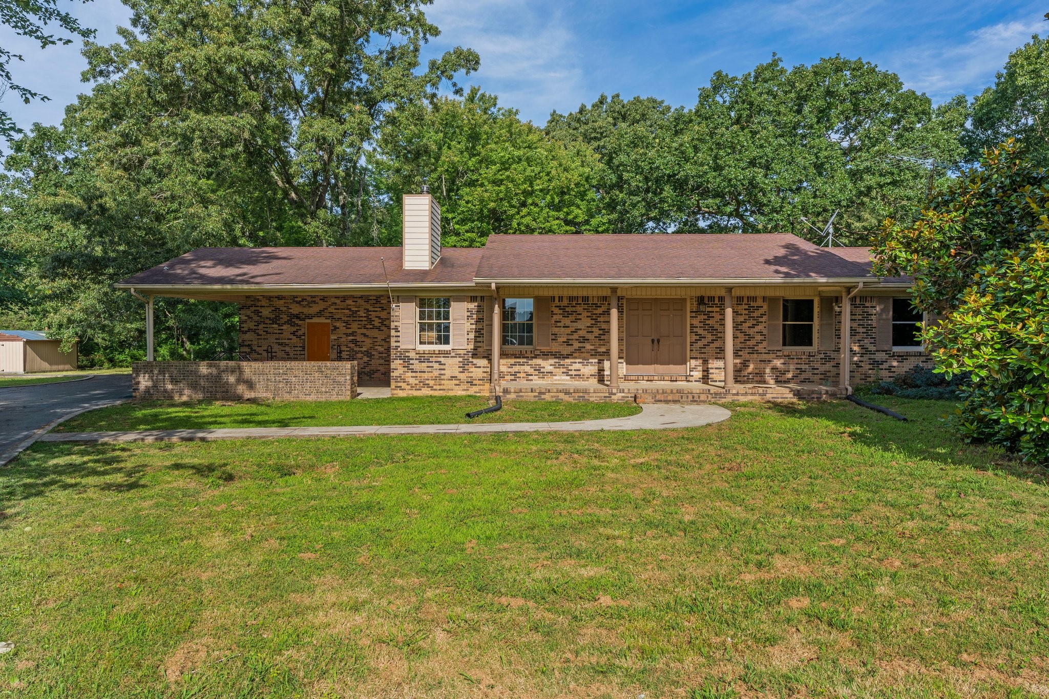 a front view of a house with garden