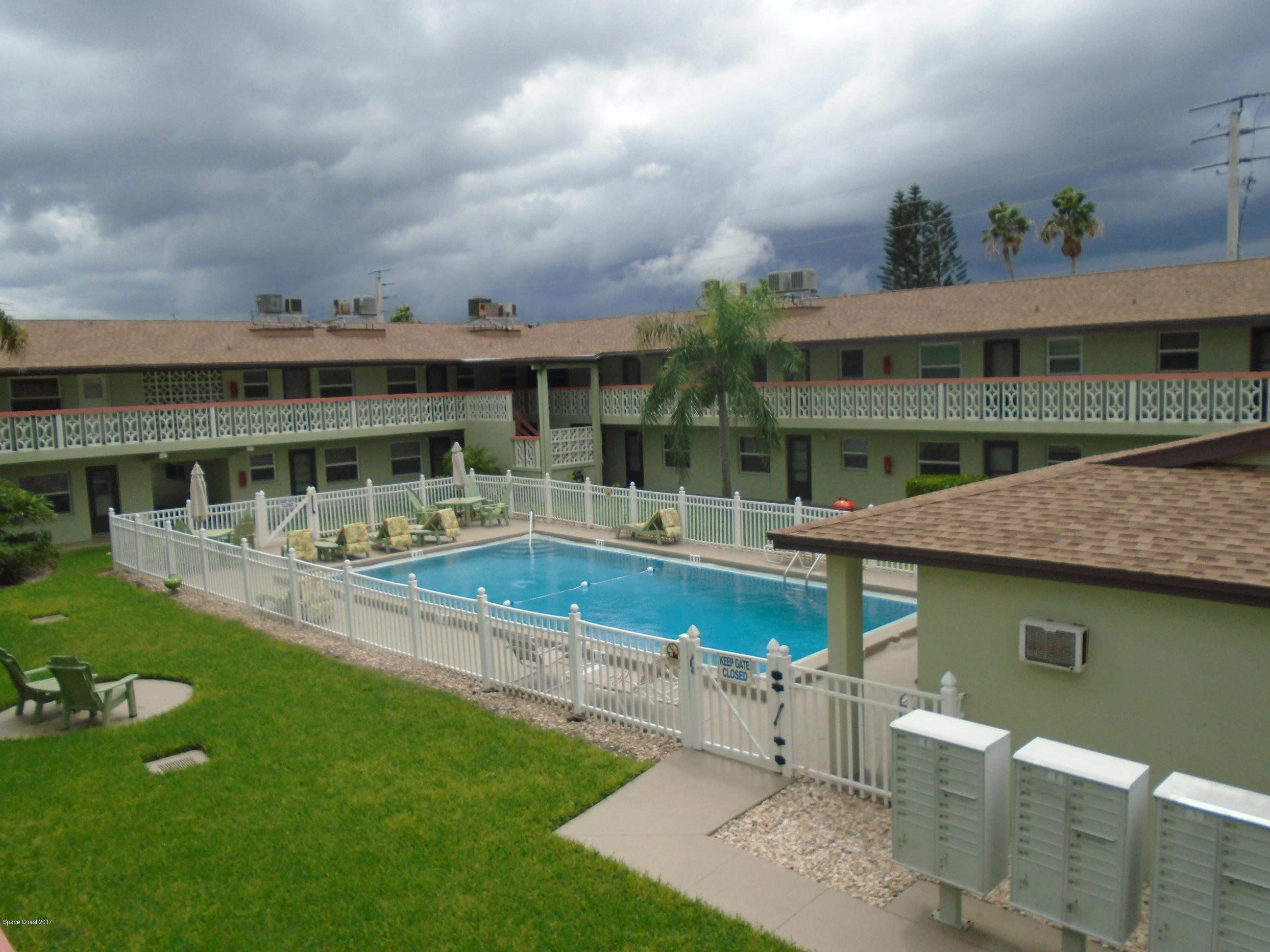 a view of house with outdoor space and swimming pool