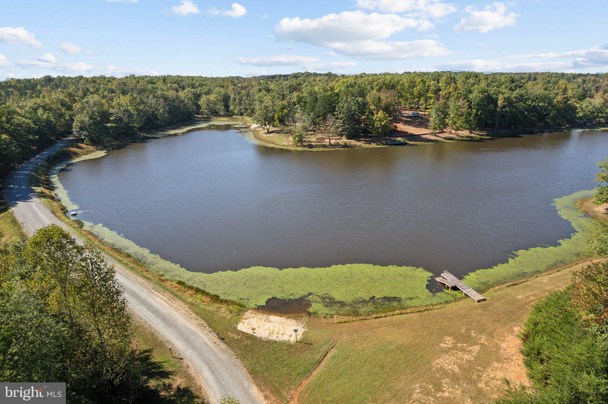 a view of a lake with a yard