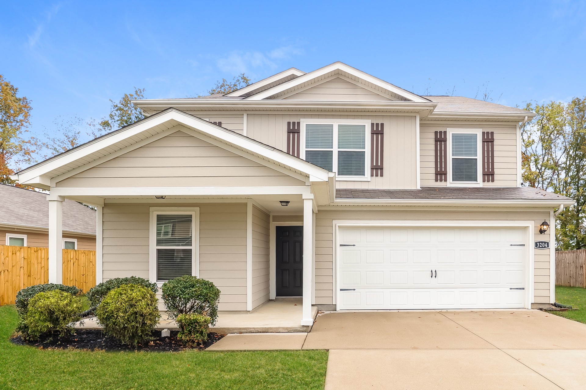 front view of a house with a yard