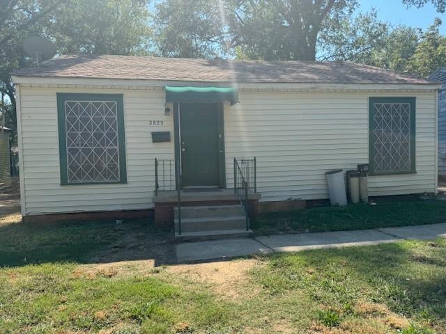 a front view of a house with garage