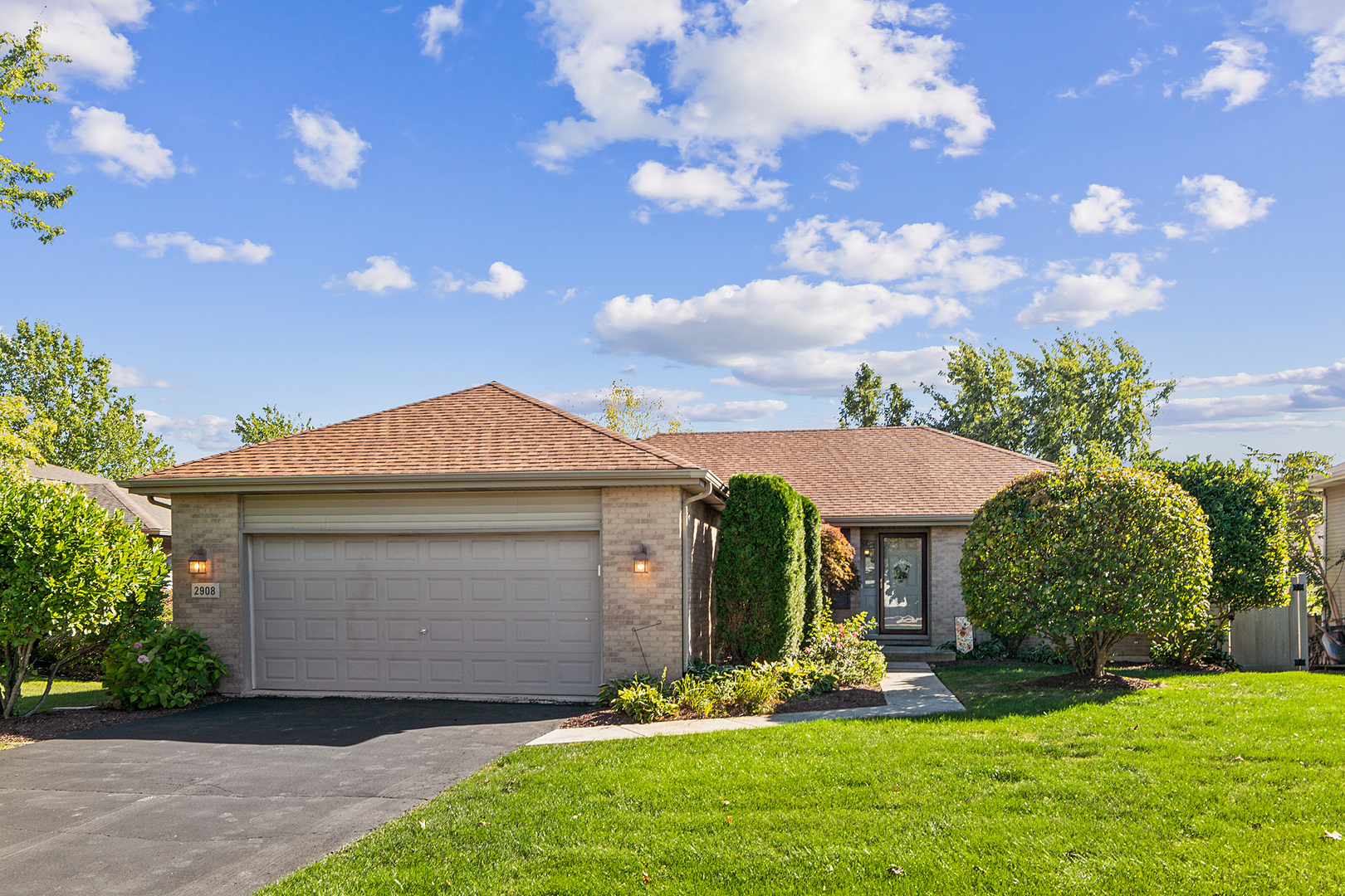 a front view of a house with a yard