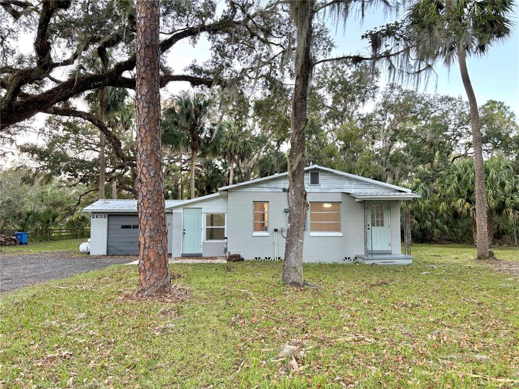 a house with trees in the background