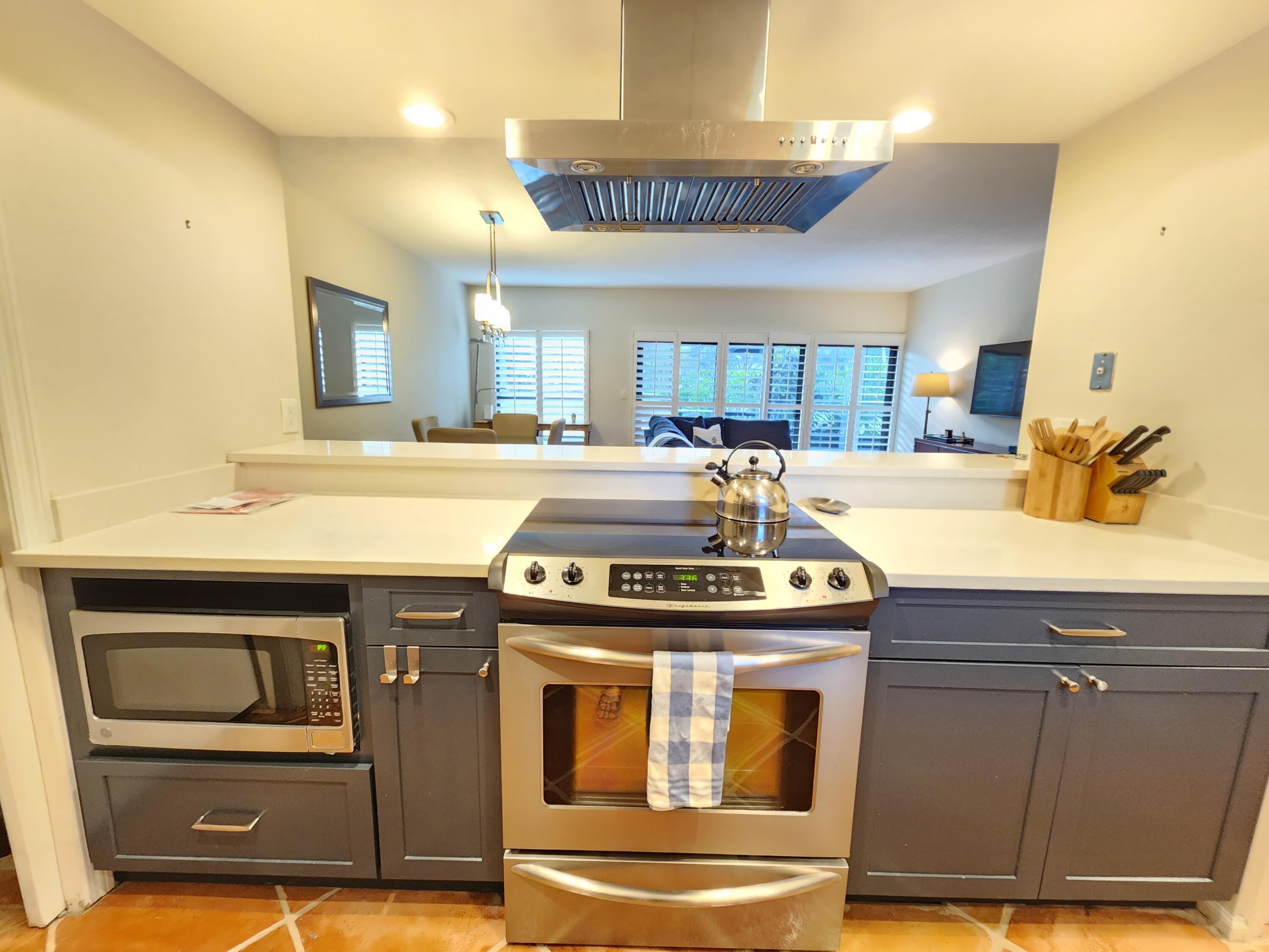 a kitchen with a stove and a sink