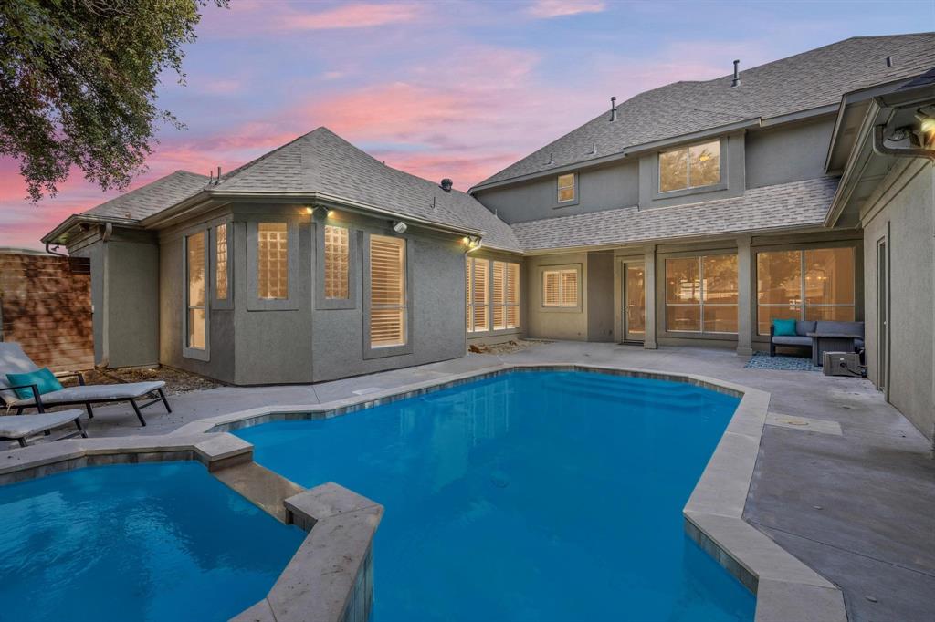 a front view of a house with swimming pool