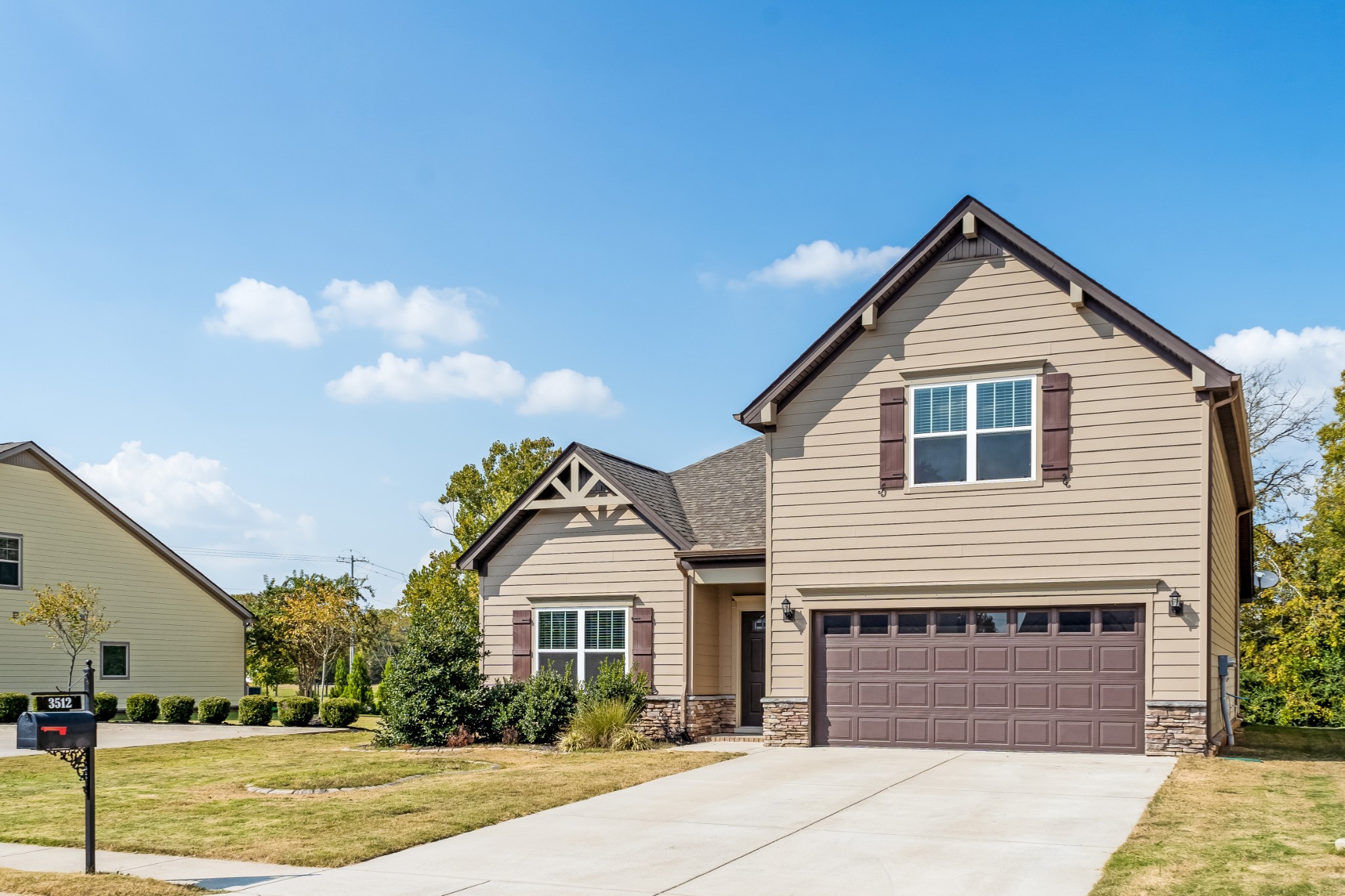 a front view of a house with a yard