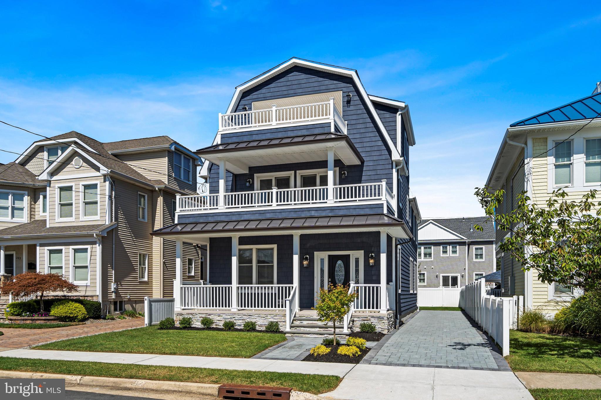 a front view of a residential apartment building with a yard