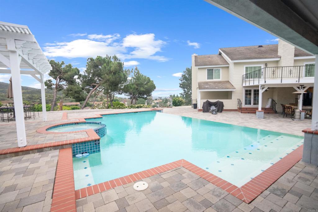 a view of a swimming pool with a patio