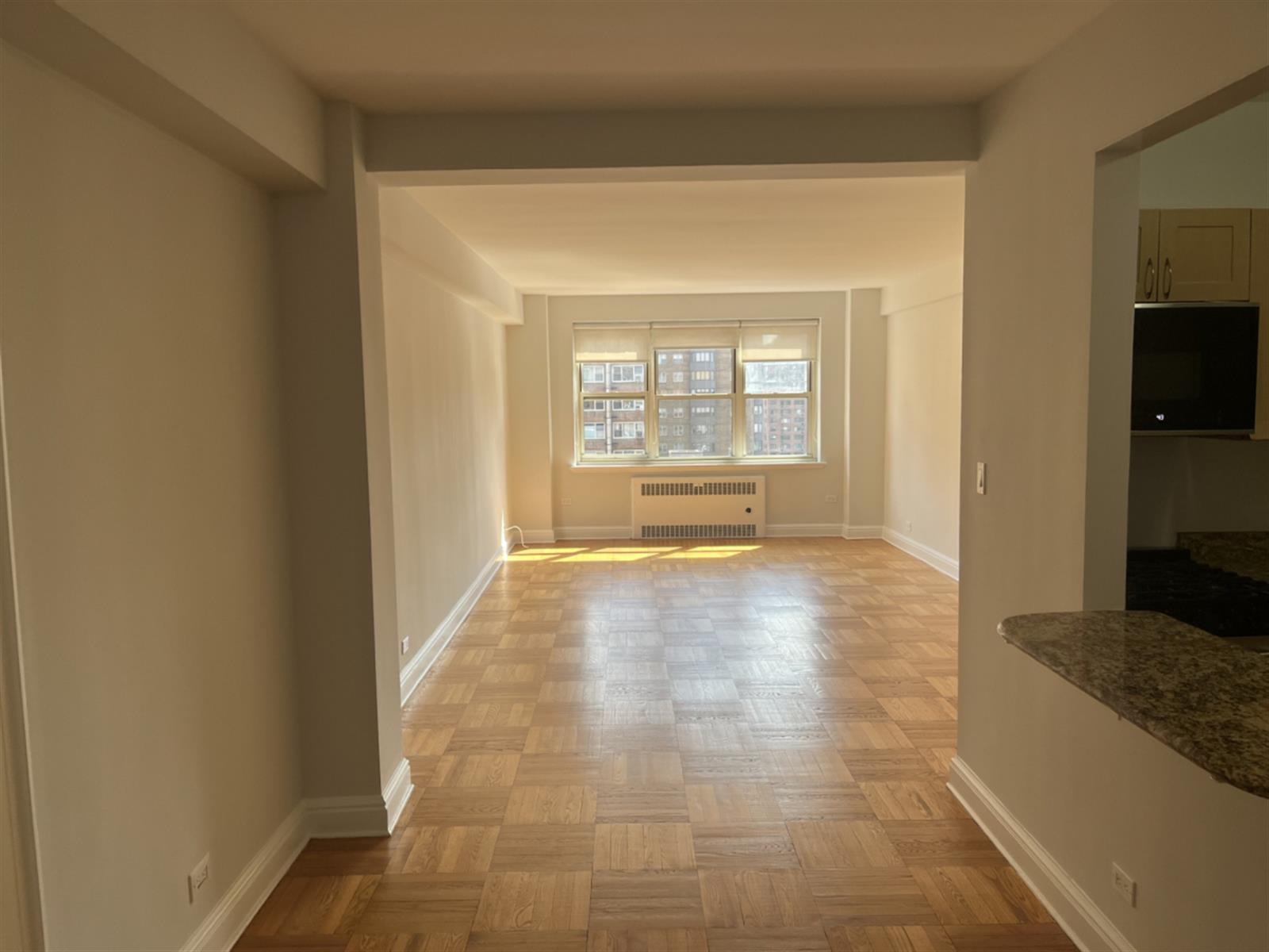 a view of an empty room and window