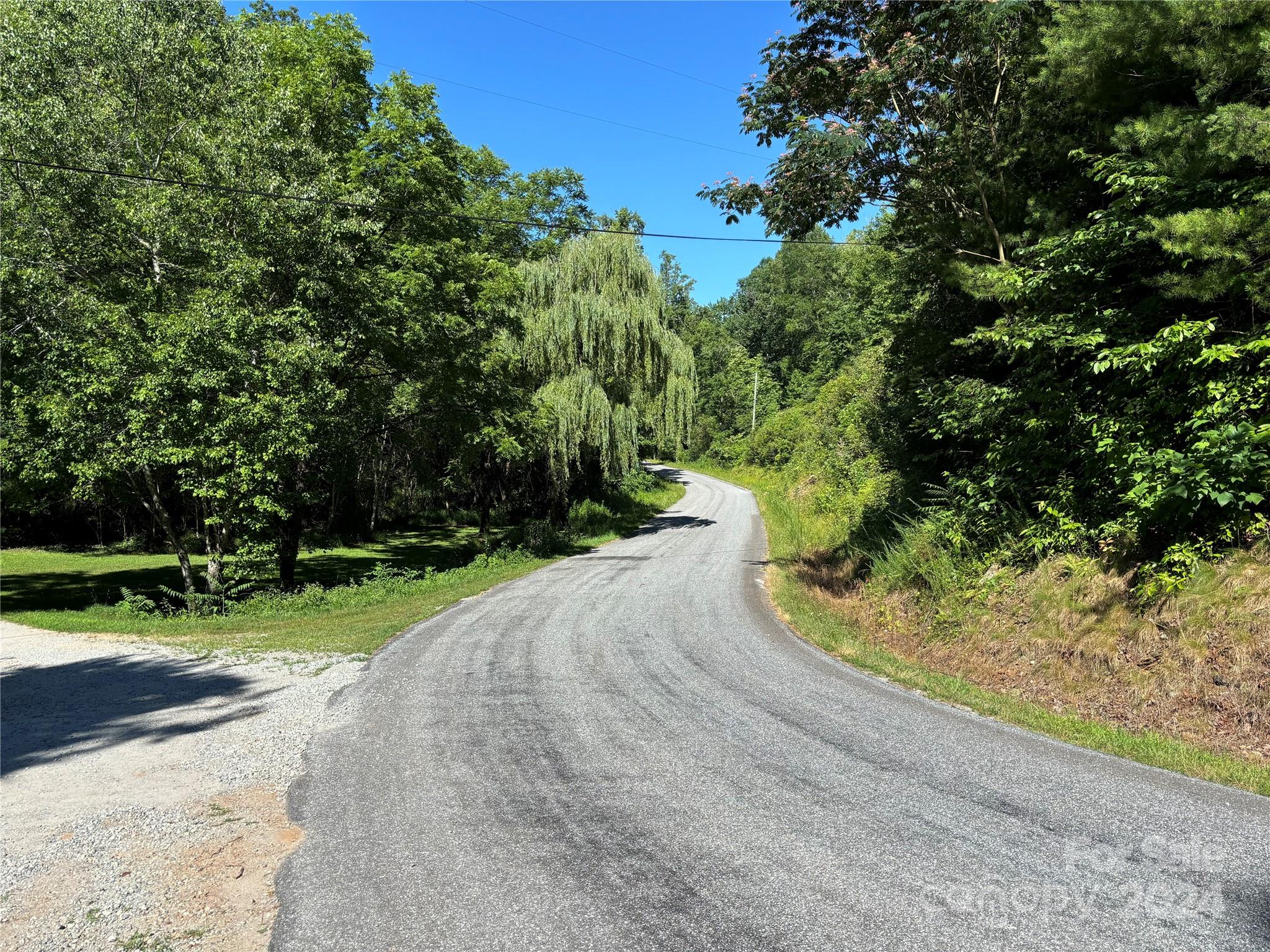 a view of a road with a yard