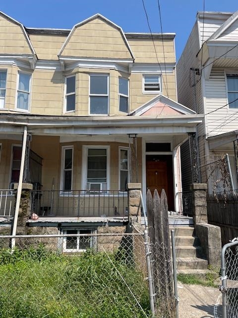 front view of a house with a small yard