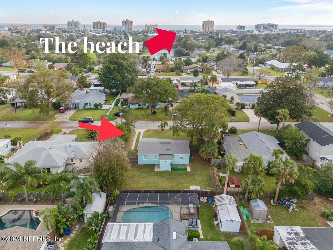 an aerial view of residential houses with outdoor space